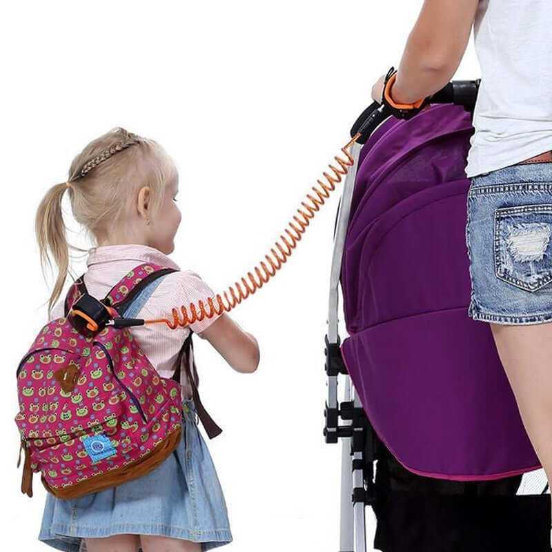 Child Safety Wristband in use, connecting child with a stroller, promotes safety and freedom in crowded areas.